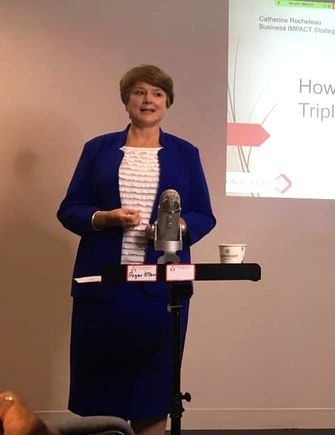 Catherine Rocheleau speaking at podium at Vancouver Business Network event