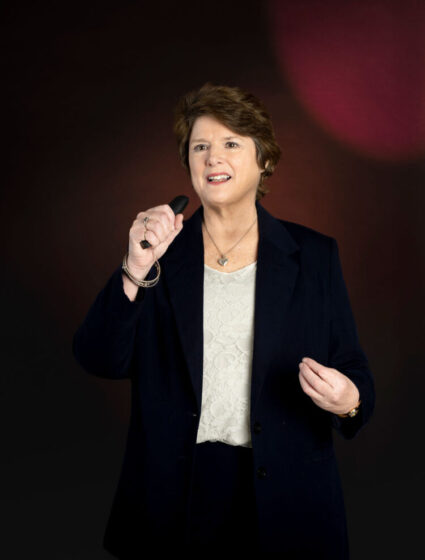 Catherine speaking on stage