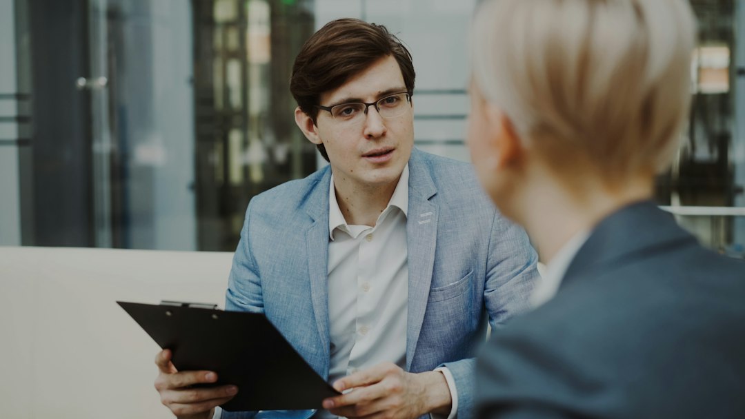 photo-1758518727653-5650fd9e146c Man interviewing a potential employee - career search